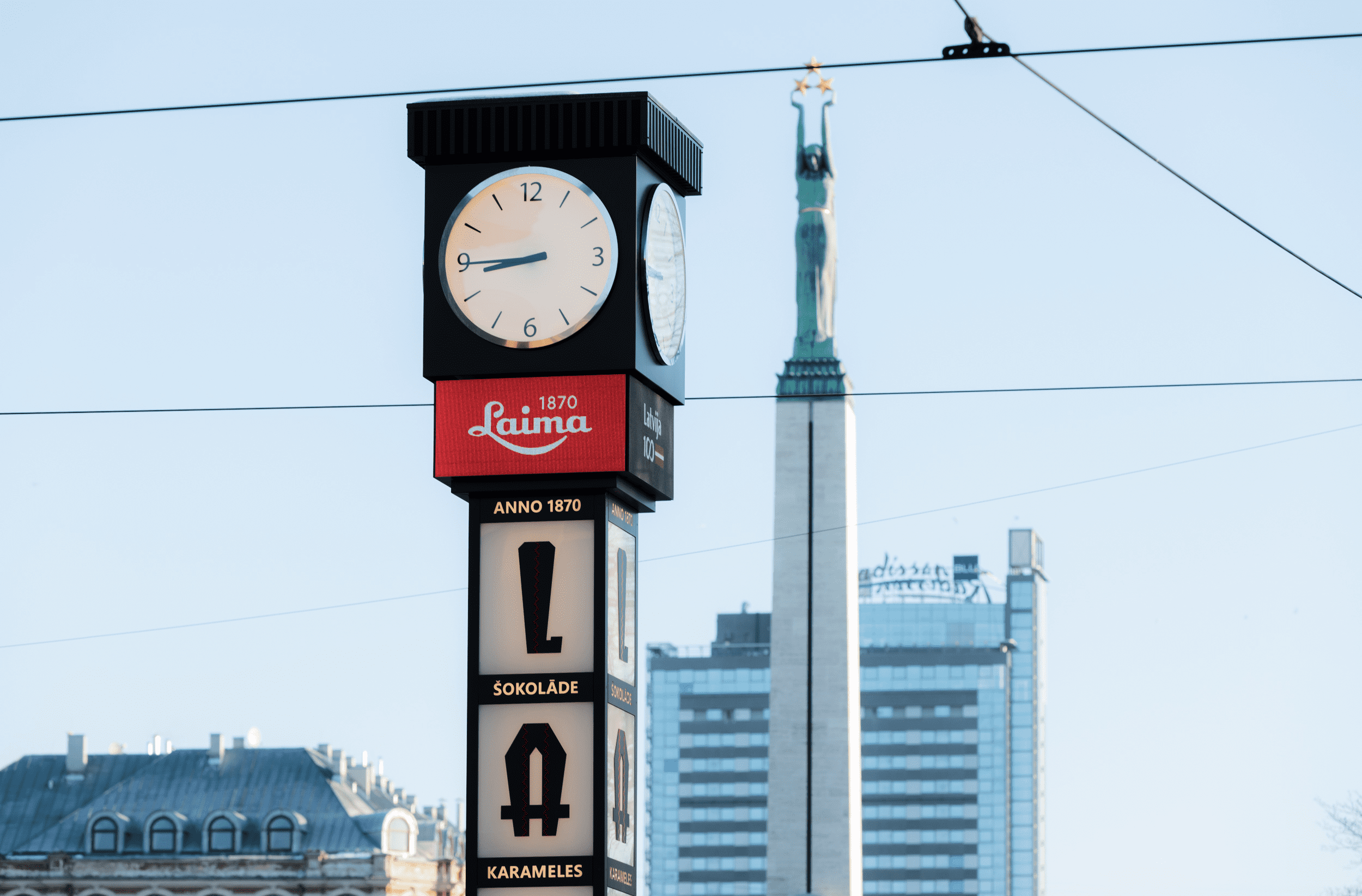 PALAMI Group Four Sided LED Video Display Laima Clock In Riga