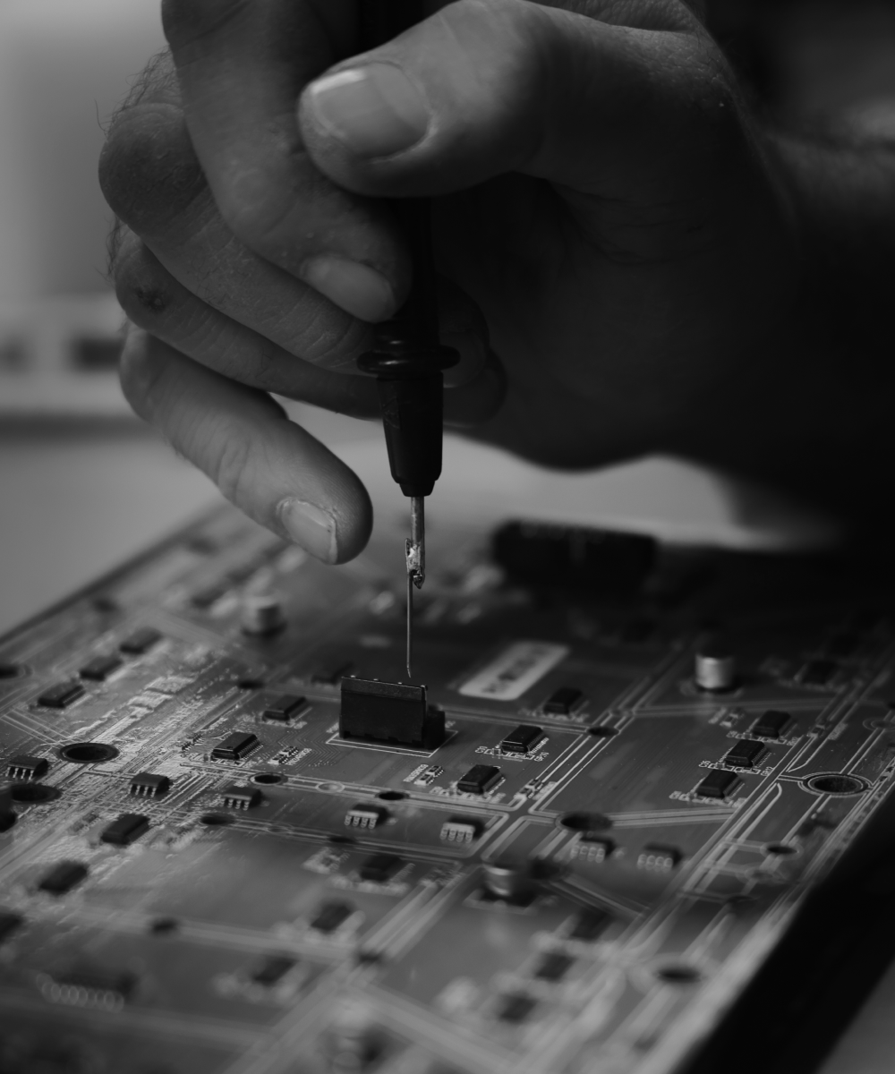 Image of PALAMI Group Engineer Working Over LED Display PCB